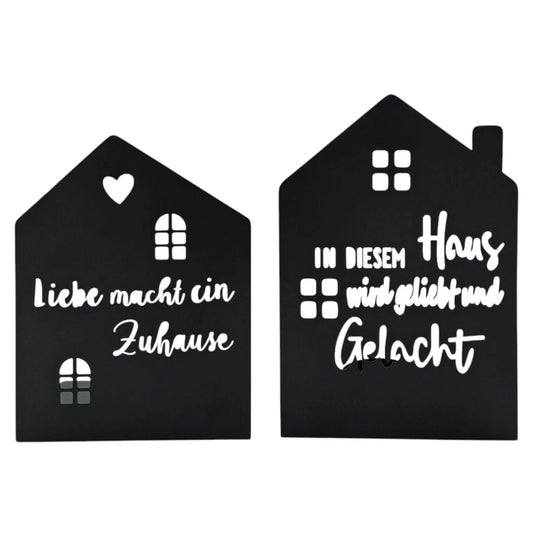 Zwei Teelichthalter in Hausform aus schwarzem Metall